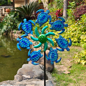 COOZZYHOUR blue sea turtle wind spinner catches sun and sways with breeze.