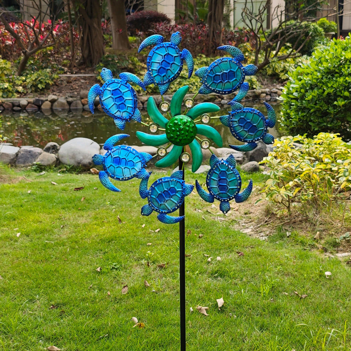 COOZZYHOUR metal wind spinner garden decor with turtle detail enhances outdoor ambience.