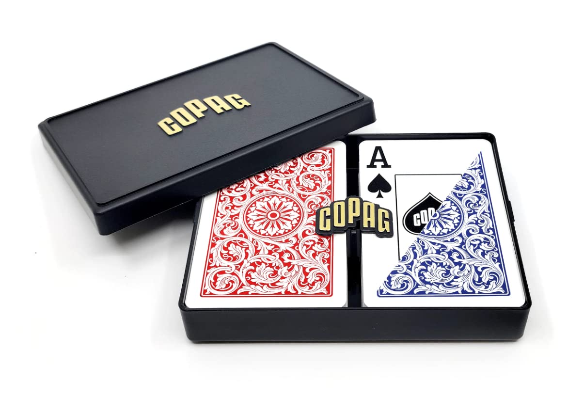 Copag 1546 playing cards in red and blue with bridge-size narrow format for smooth shuffles.