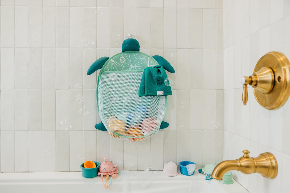 Copper Pearl Oceana characters Finn, Cora, and Wade add playful bath time charm.