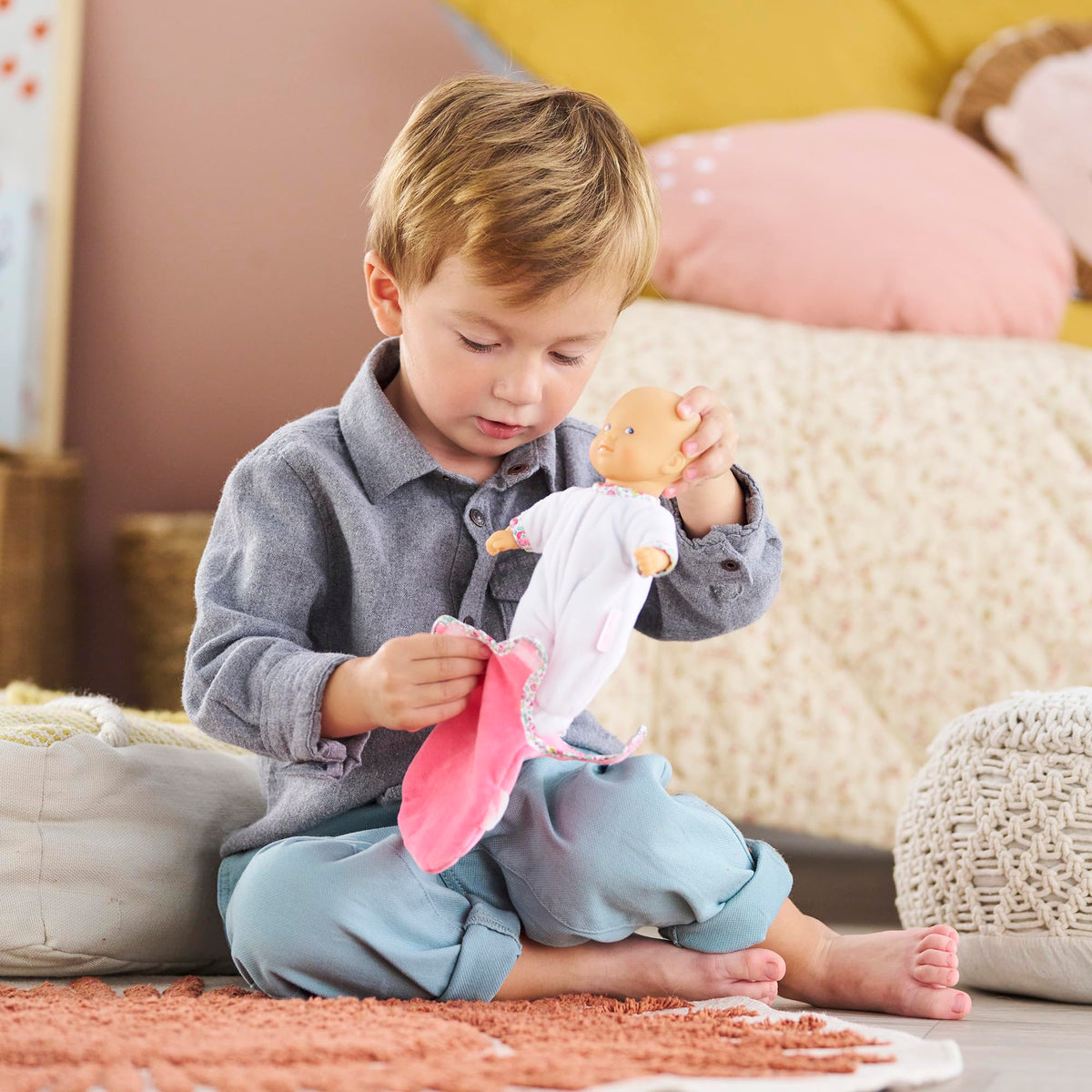 Corolle Mini Calin vanilla-scent skin enhances tactile play.
