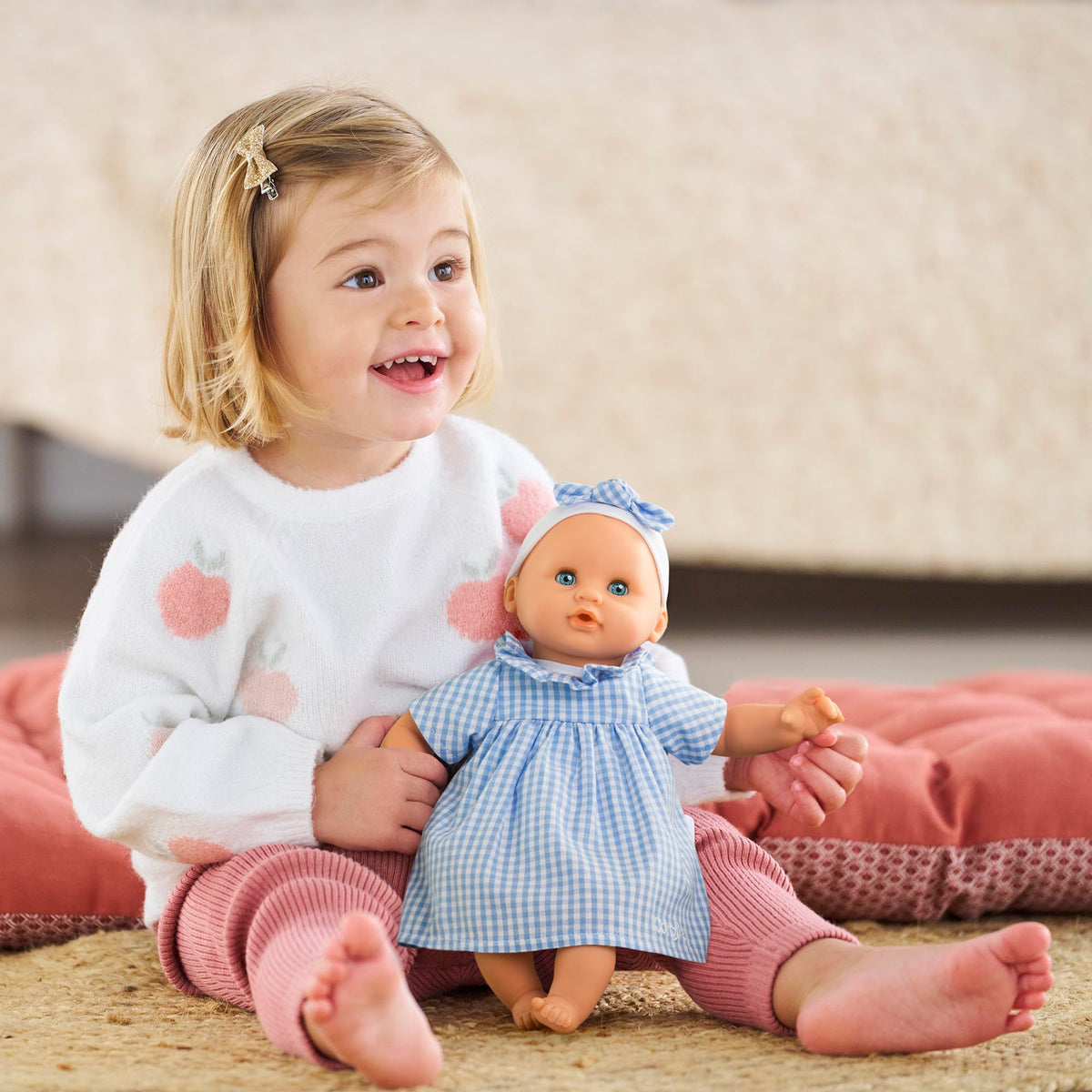 Corolle Premier Poupon Calin bean-filled body supports lifelike posing.