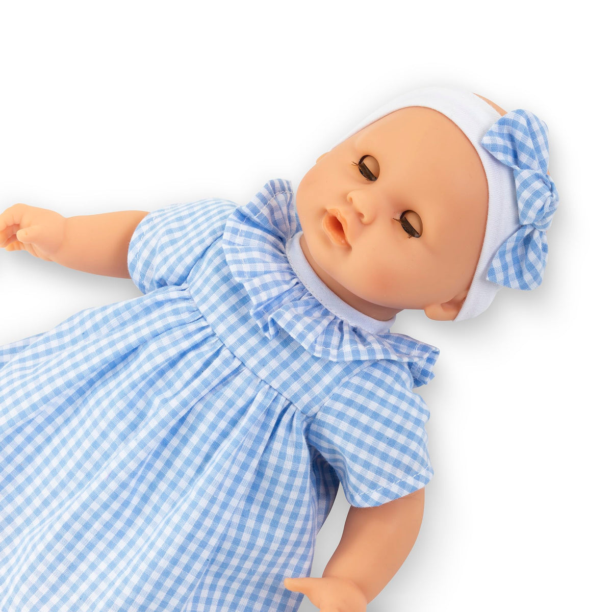 Corolle Premier Poupon Calin matching cap completes cozy outfit.