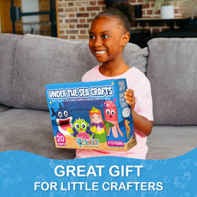 Craftikit shark paper craft shows kids turning ocean shapes into art.