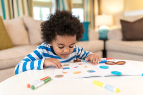 Crayola Color Wonder markers releasing cherry and blueberry scents during play