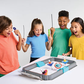 Crayola Colourwhirls spinning tops in action create vibrant swirling patterns.