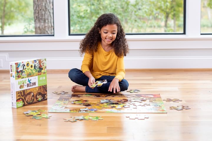 Crocodile Creek Above + Below forest/backyard scene puzzle on the floor.