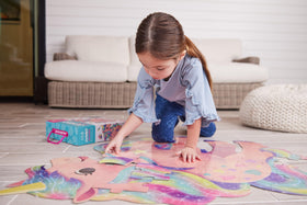 Crocodile Creek Above + Below storage box with a handle keeps puzzle pieces organized.