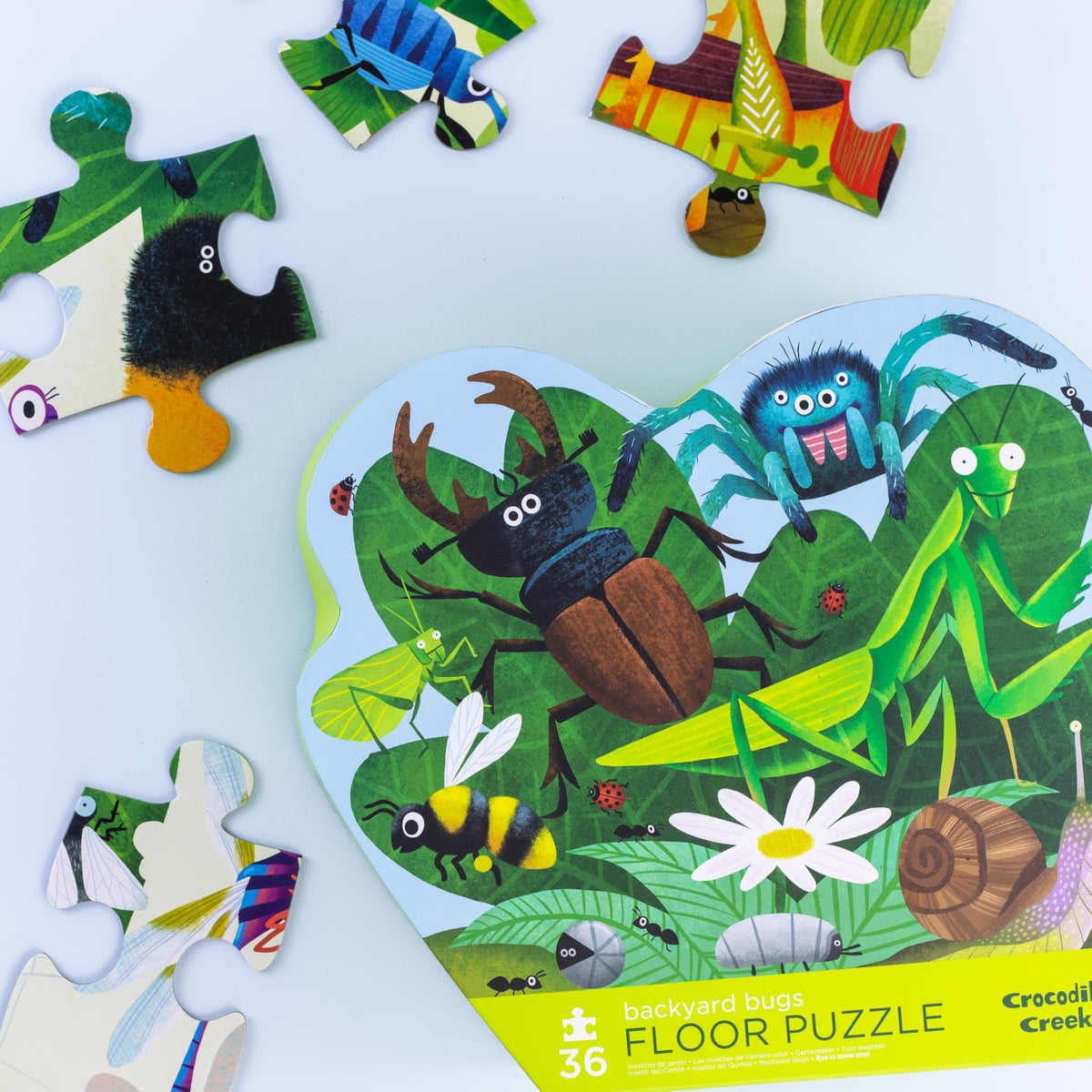 Vibrant Backyard Bugs artwork by Crocodile Creek invites imaginative floor play.