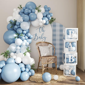 CROSSFINGERS dusty blue balloon arch kit creates a stylish backdrop for baby showers.