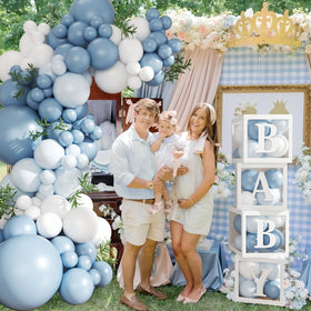 CROSSFINGERS transparent baby boxes add playful centerpiece elements.