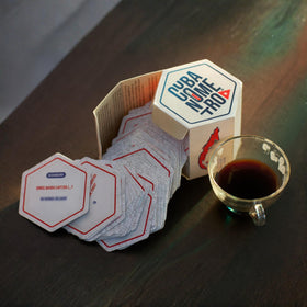 Cubanometro cards spread on table, perfect for lively group conversation.
