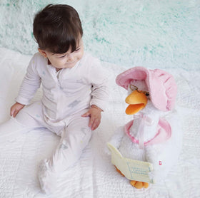 Mother Goose wearing glasses, hat, and shawl for charming storytelling.