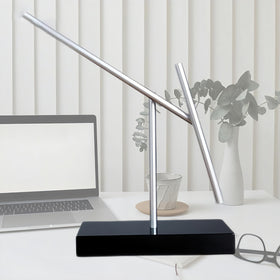 CulinaryEdge kinetic energy sculpture illuminated, highlighting dynamic movement and modern lighting appeal.