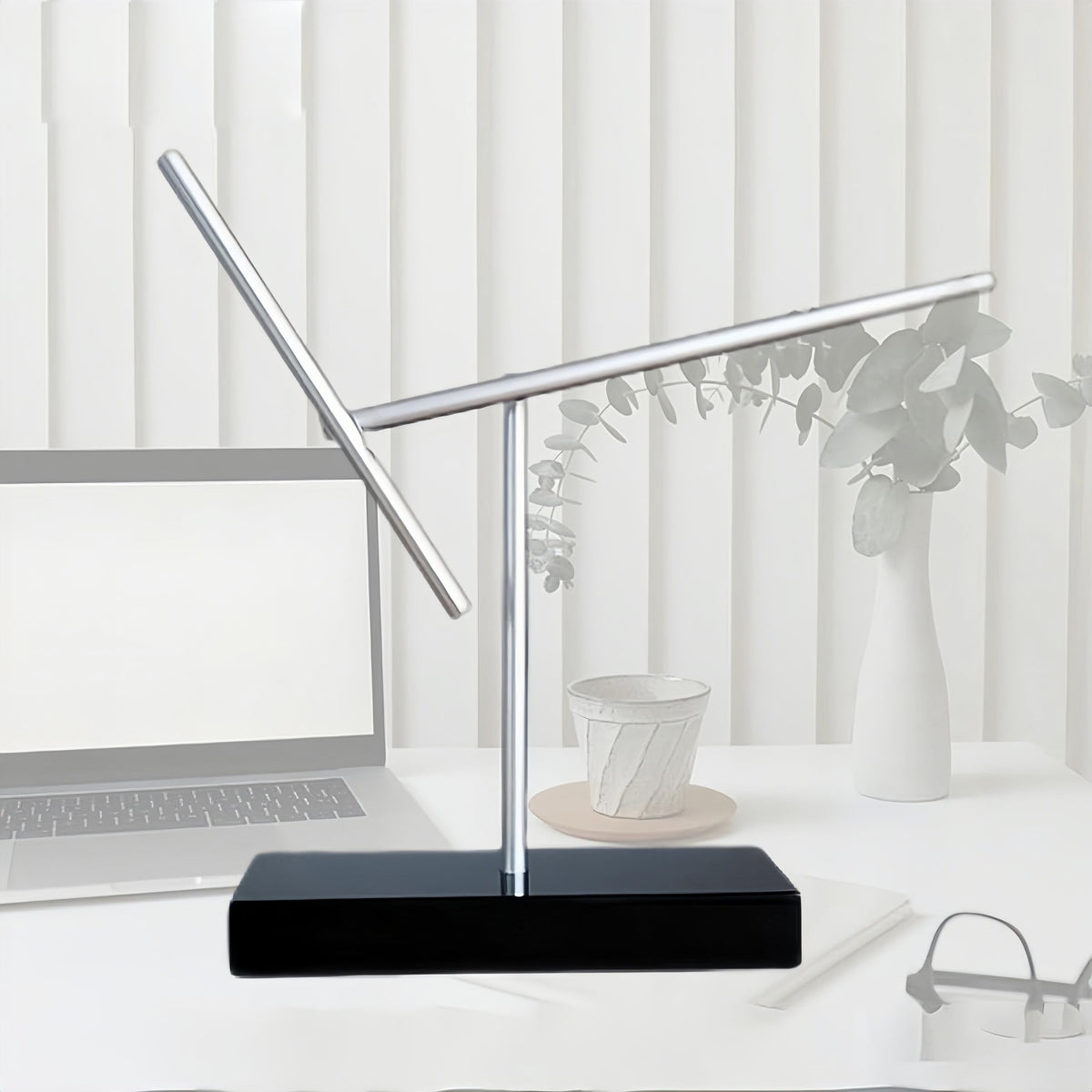 CulinaryEdge kinetic energy sculpture side angle emphasizes a calm hypnotic motion in any workspace.