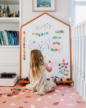 Curious Columbus blue vowels magnets aid vowel recognition.