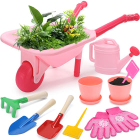 CUTE STONE pink wheelbarrow with tools inspires imaginative backyard play for toddlers.