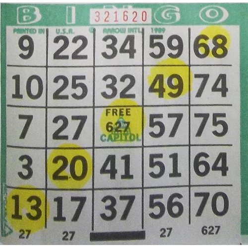 In-use shot shows Dab-O-Ink yellow bingo dauber during game for visibility.