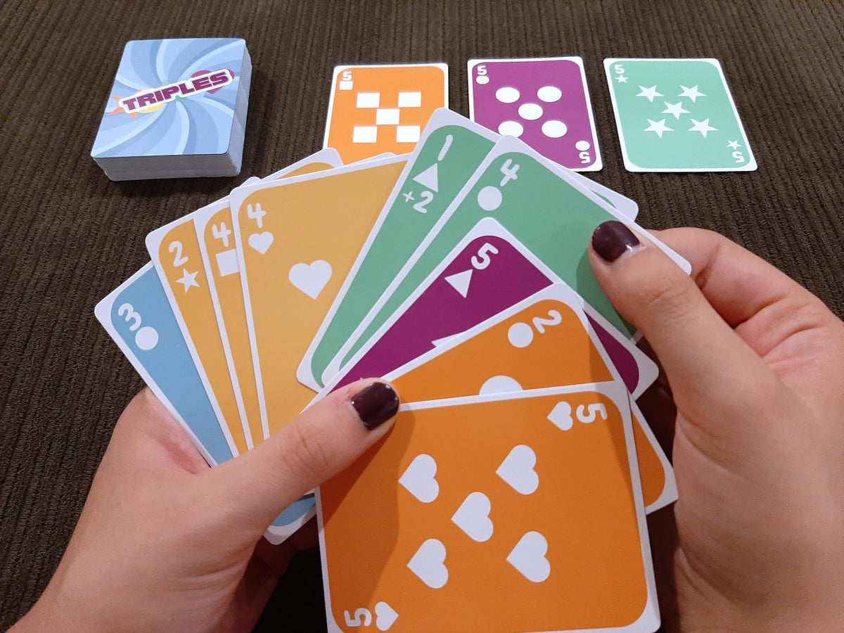 Dad Bomb Games Triples hand of cards ready for simple rules.