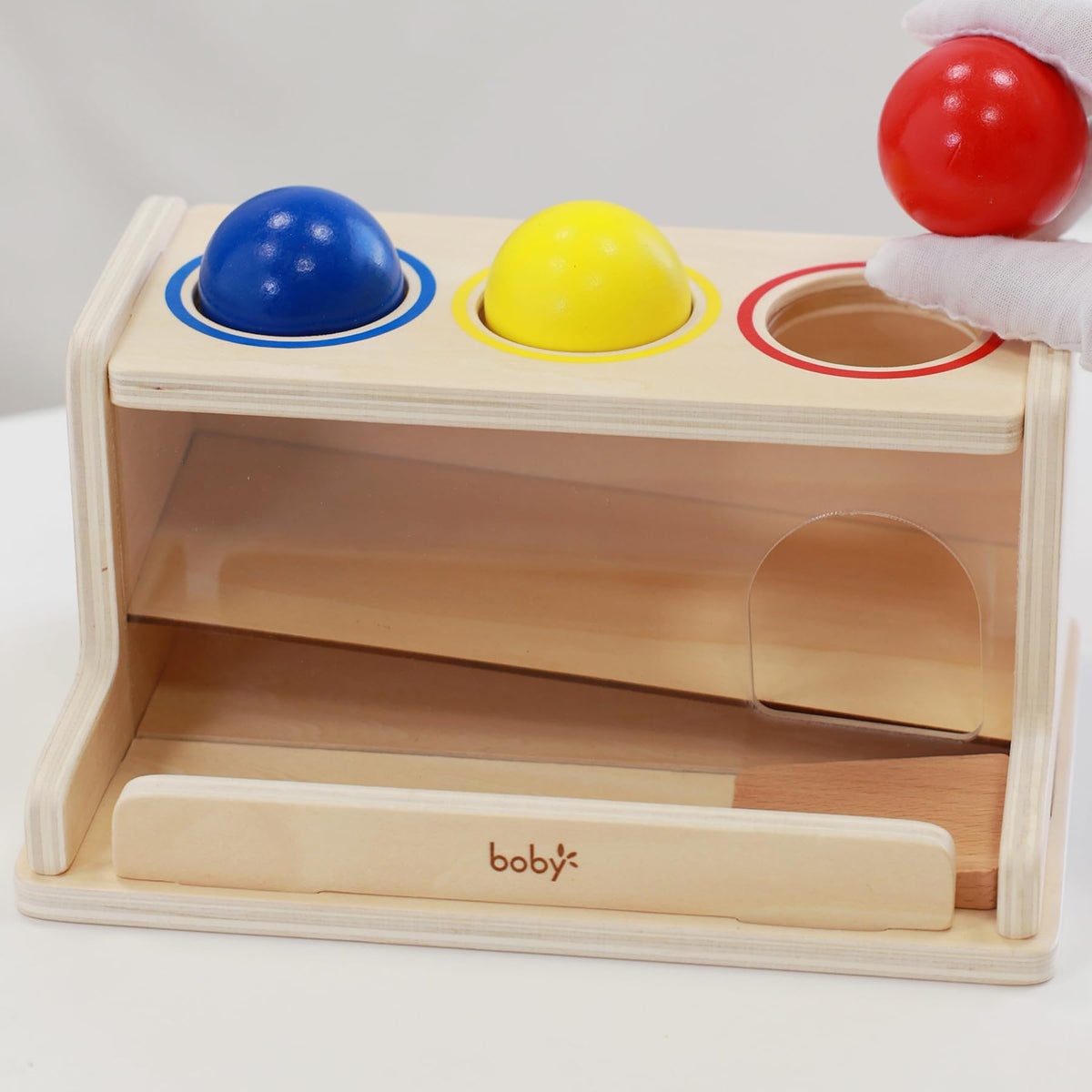 Dailyfunn drop-push toy in a child’s hands during play.