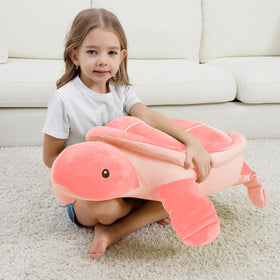 Dalmao turtle plush used as a reading pillow for relaxed evenings