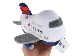 Daron Delta plush toy in hand shows portable size for travel fun.