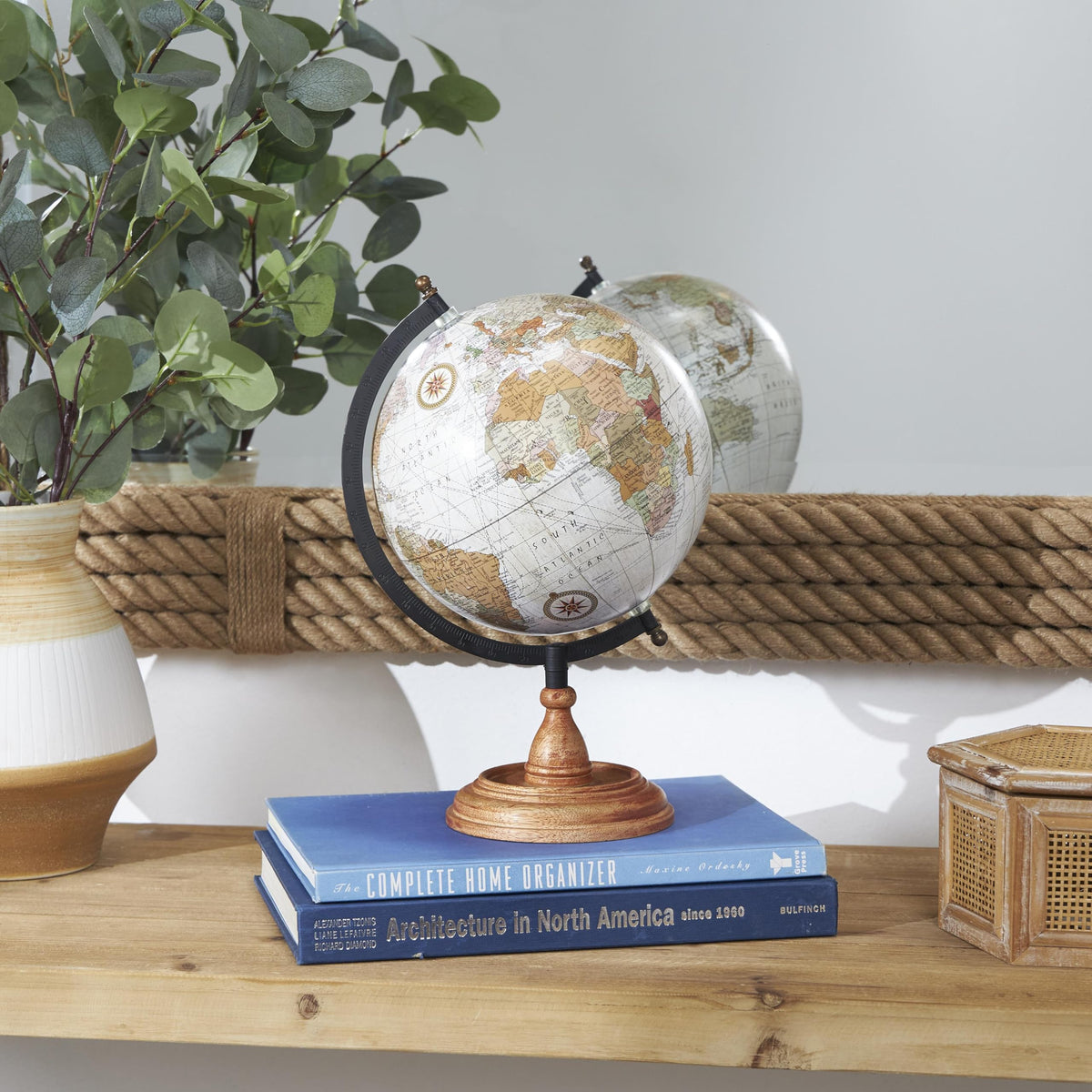 Deco 79 globe map print adds color and curiosity to decor