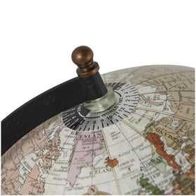 Deco 79 globe on coffee table demonstrates compact tabletop elegance
