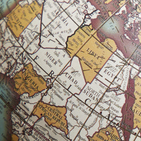 Globe on stand displayed on a clean surface for best viewing.