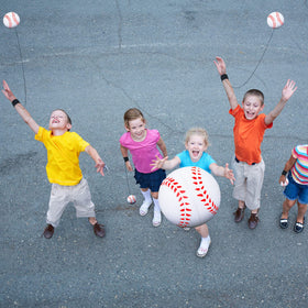 People enjoying outdoor group play with Deekin wrist-return balls