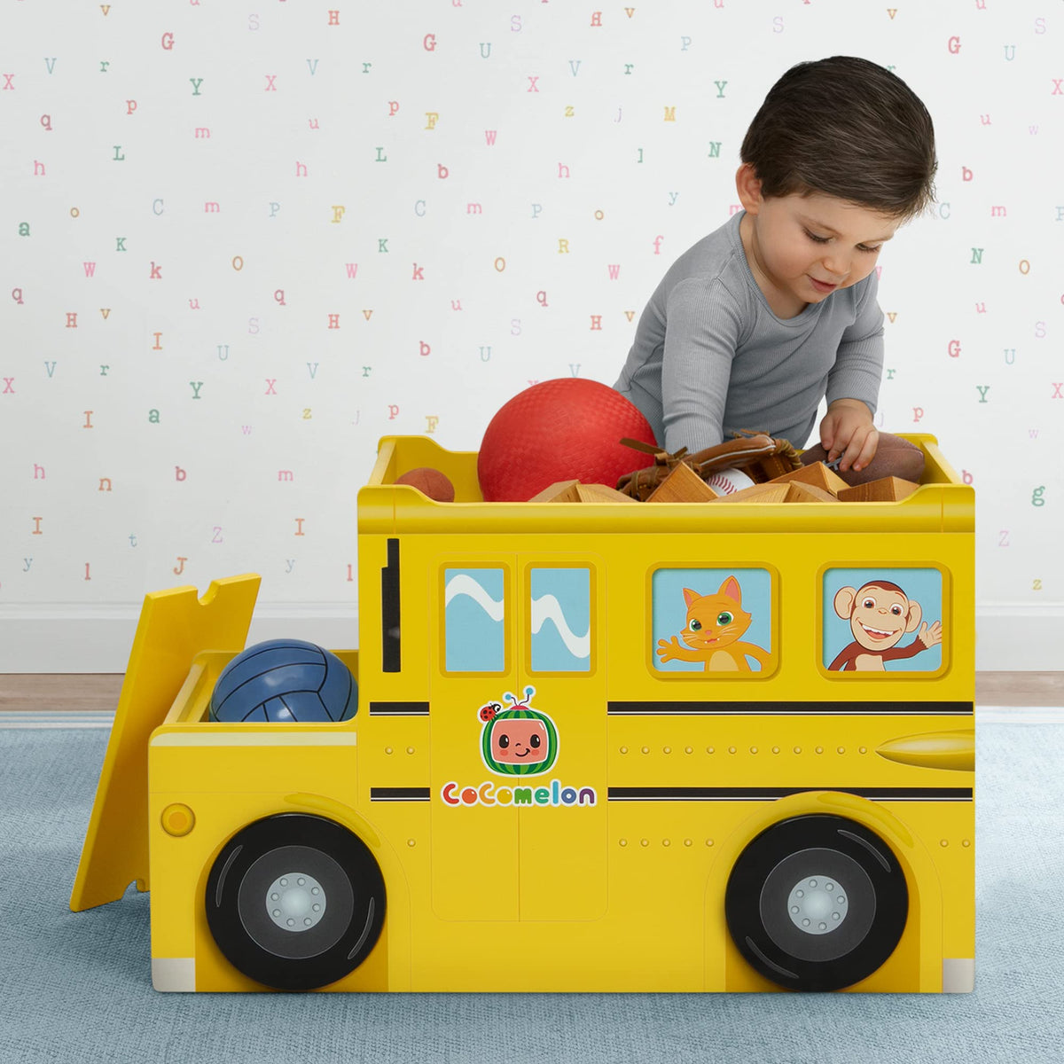 Delta Children CoComelon bus front storage bin keeps books neatly tucked