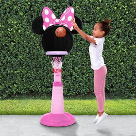 Delta Children Minnie Mouse height-adjustable hoop shown in action for growing players.