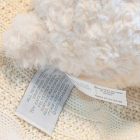 DEMDACO artisan soft toy bear design highlighting craftsmanship