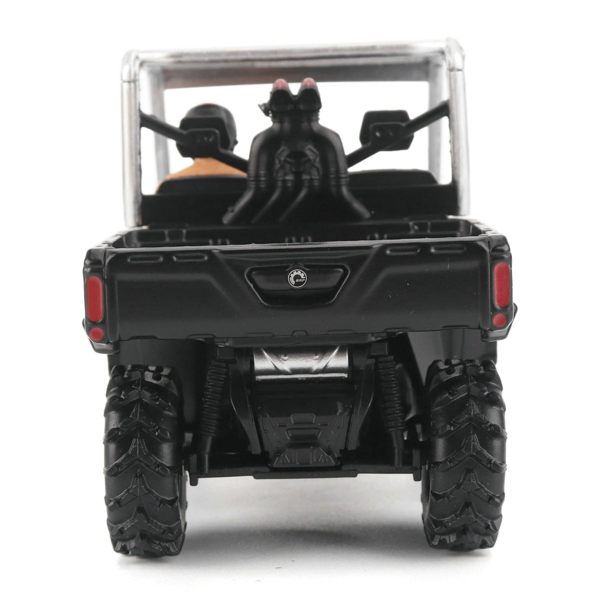 Diecast Masters Can-Am Defender X MR Silver deep tread tires invite tactile appreciation on display.