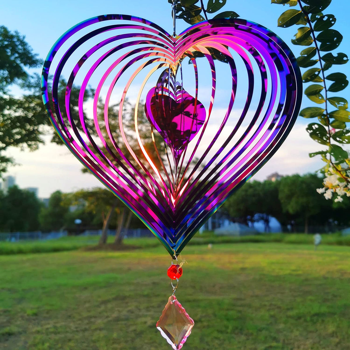 Dinoneyi wind spinner with heart-pattern 3D design enhances outdoor yard decor