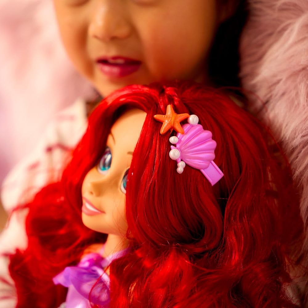 Disney Store Ariel Once Upon a Story doll includes seashell and starfish hair accessories.
