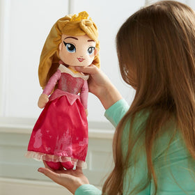 Disney Store Aurora plush doll wearing satin gown for magical storytelling