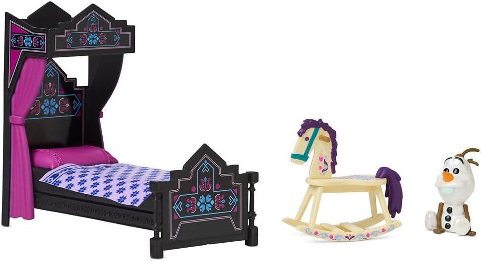 Disney Store bed with print blanket for cozy play scenes.