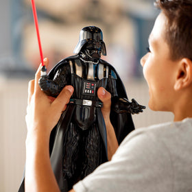 Disney Store Darth Vader glowing lightsaber highlights immersive light and battle scenes.