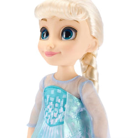 Molded shoes and shimmering cape complete Elsa's princess look
