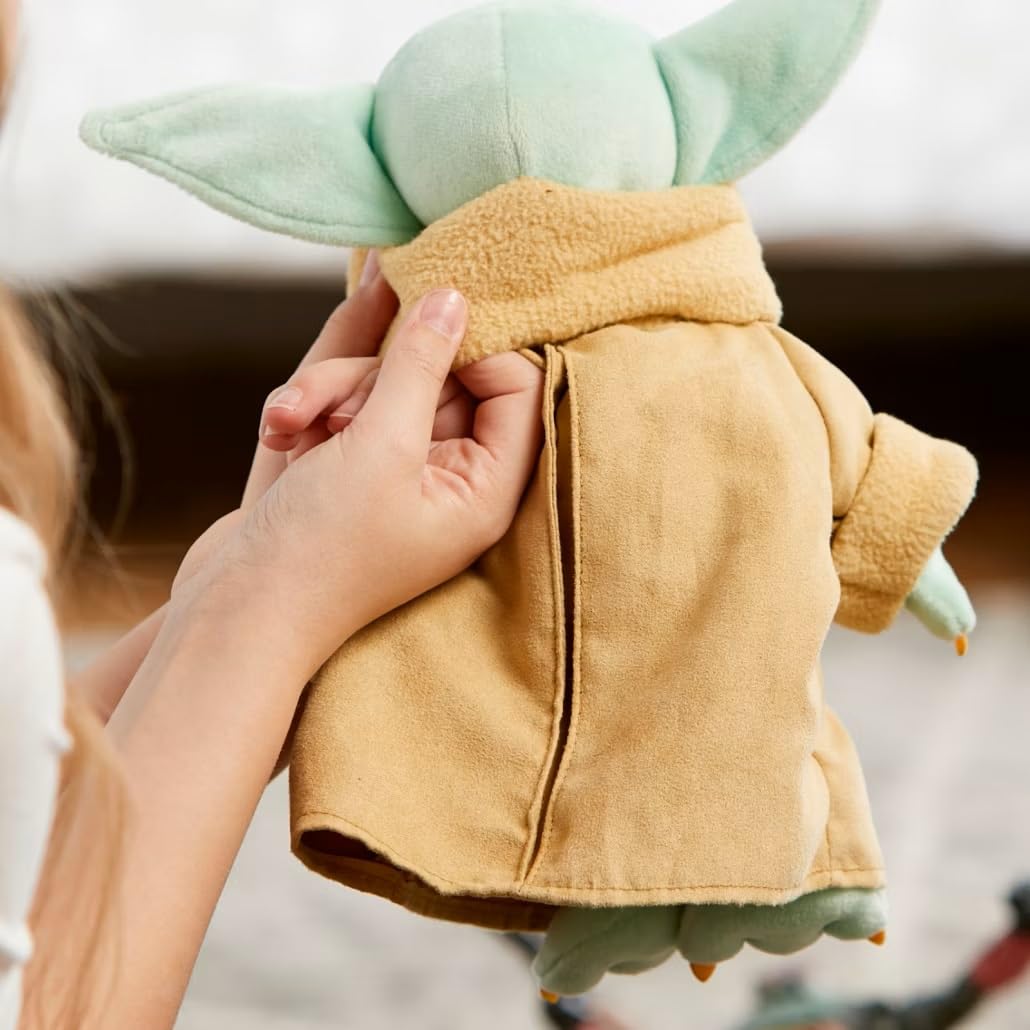 Disney Store Grogu plush featuring a faux suede coat for a premium look.