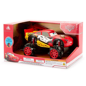 Disney Store Lightning McQueen RC car pictured on track delivering fast action.