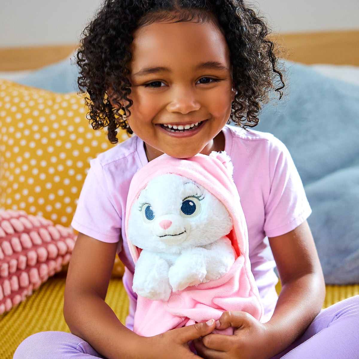 Marie plush with reversible swaddle for versatile styling and cuddles