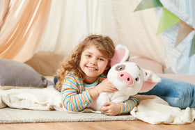 Disney Store Pua pink ears and friendly face, invites hugs.