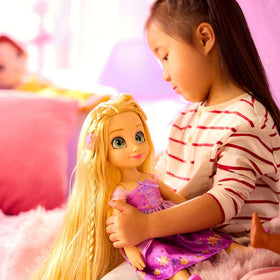 Disney Store Rapunzel deluxe costume highlights satin bodice and shimmering sleeves