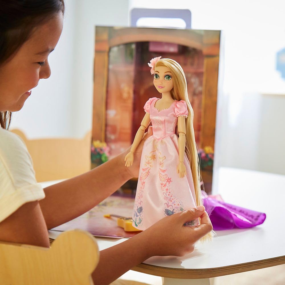 Disney Store Rapunzel Story Doll extra pink dress offers versatile styling options.