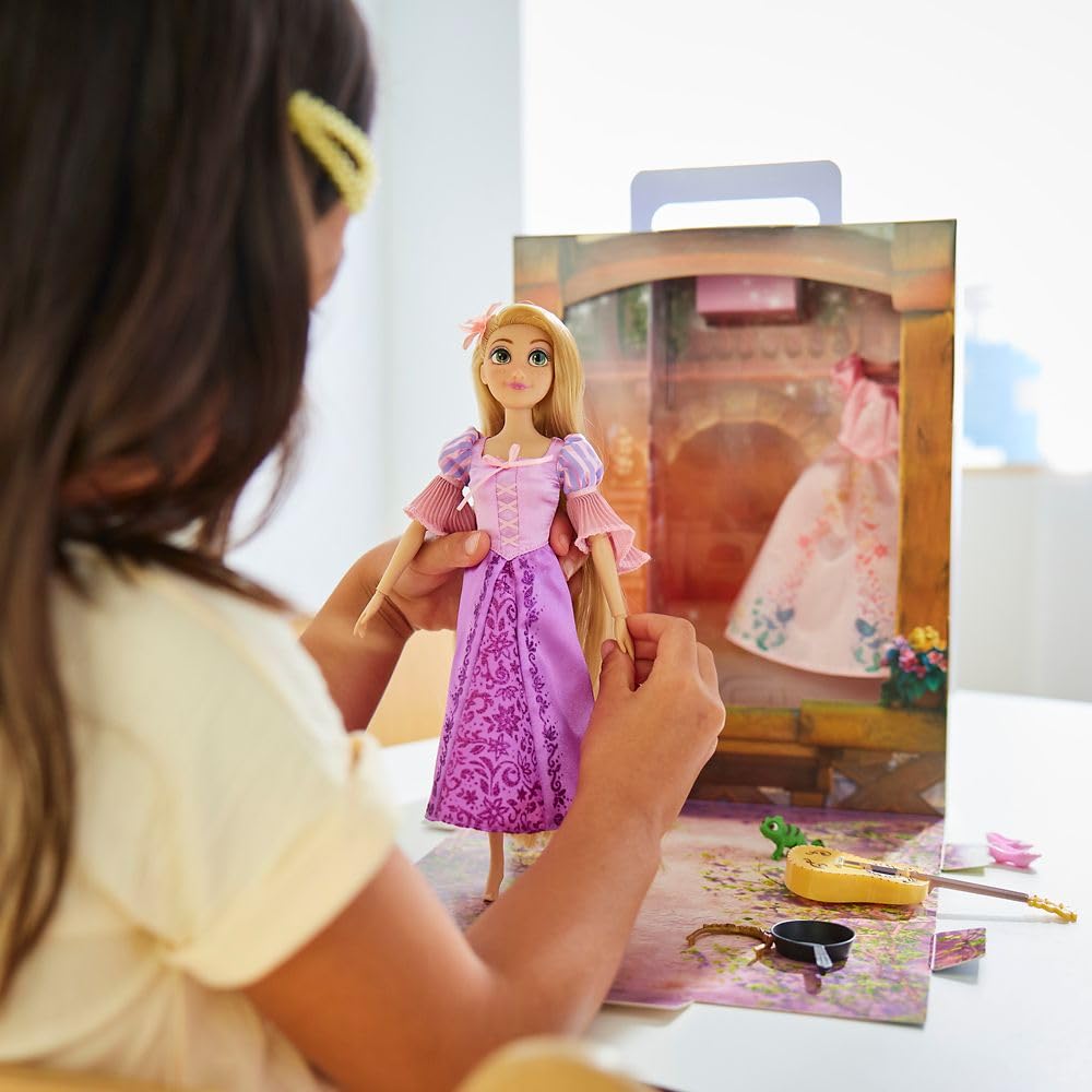 Disney Store Rapunzel Story Doll satin dress detail highlights luxurious texture.
