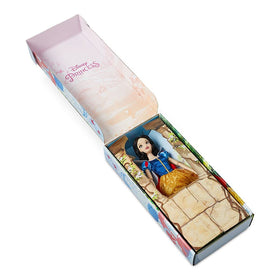 Yellow satin skirt on Snow White doll adds vibrant dress-up color.