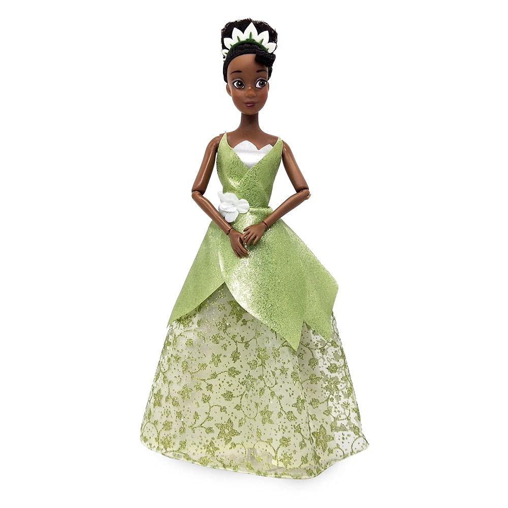 Disney Store Tiana doll includes brush accessory for styling hair.