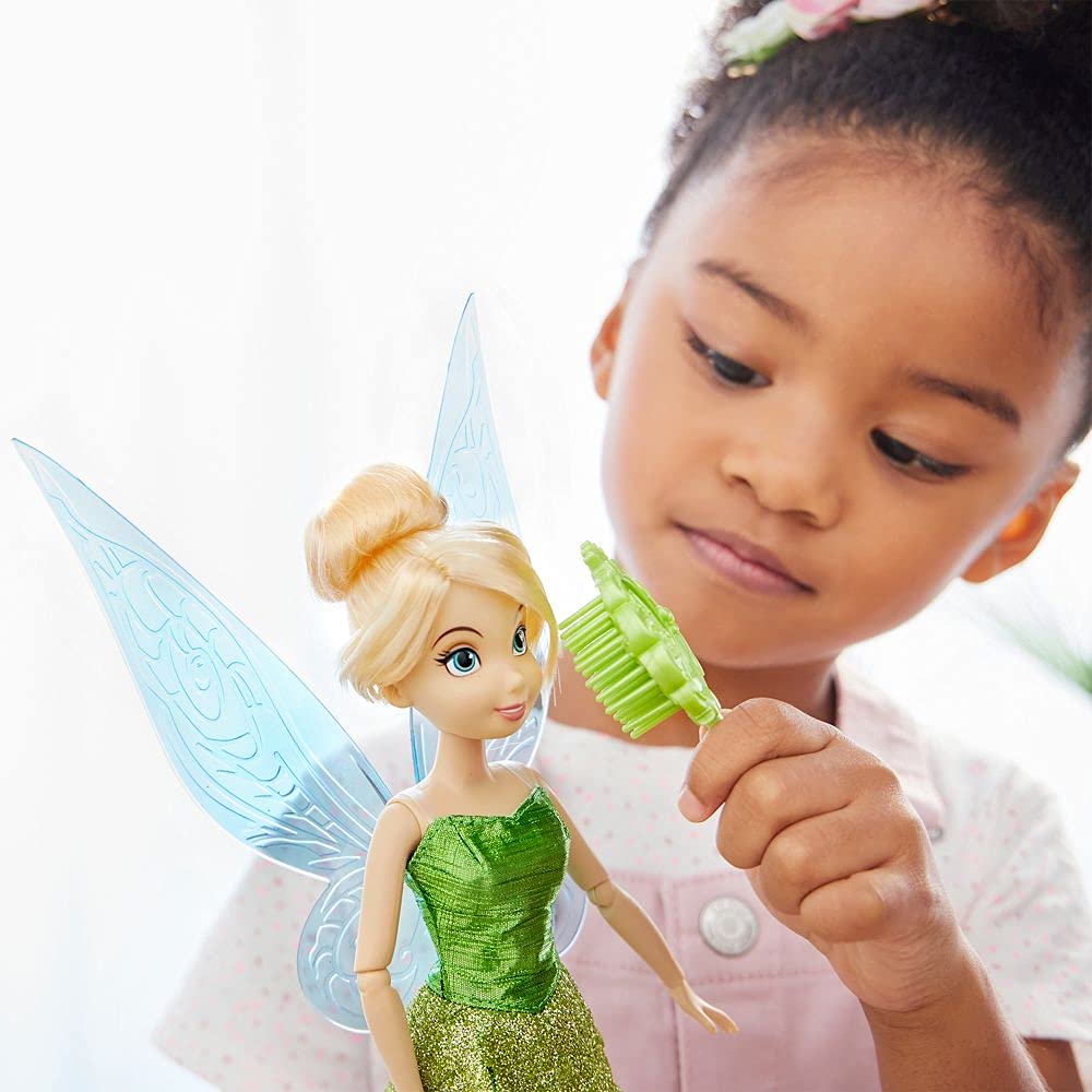 Disney Store Tinker Bell doll includes a grooming brush for care and styling.